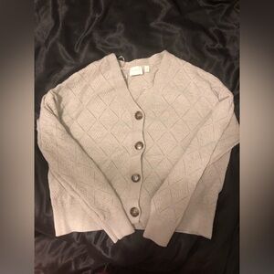 Woman’s grey cardigan